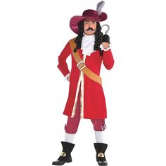 a man in a red costume is holding a pair of scissors and wearing a hat