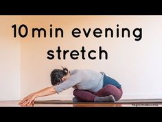 a woman sitting on the floor in front of a white wall with text reading 10 min evening stretch