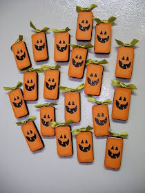 there are many small pumpkins with faces on them that have been cut out to look like jack - o'- lanterns