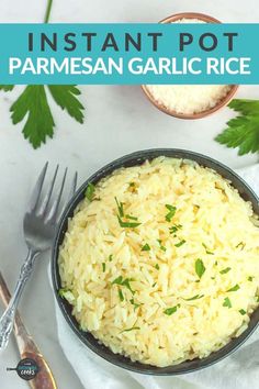 instant pot parmesan garlic rice in a bowl with a fork and spoon next to it