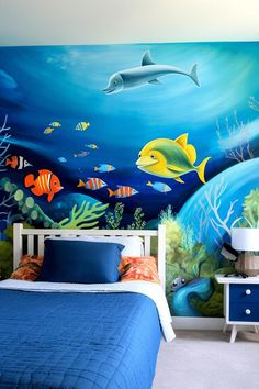 Ocean-themed toddler boy bedroom with boat bed Under The Sea Bedroom Ideas Boys, Boys Ocean Bedroom, Toddler Boys Bedroom Themes, Sea Bedroom Ideas, Animal Themed Bedroom, Pirate Toddler Bed, Ocean Kids Bedding