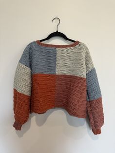 a sweater hanging up on a hanger