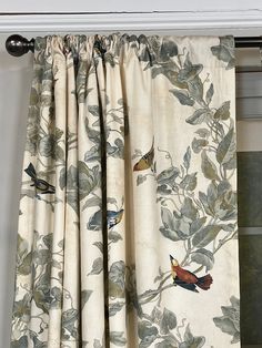 a curtain with birds and leaves on it