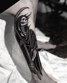 a person with a skeleton tattoo on their leg