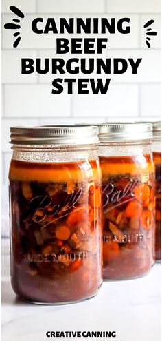 three jars filled with food sitting on top of a counter