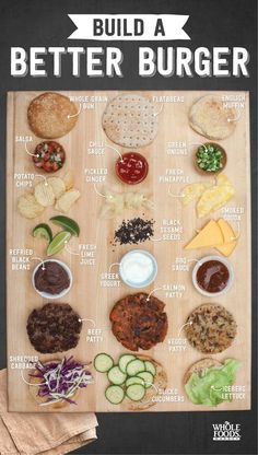 a wooden board with different types of food on it and the words build a better burger