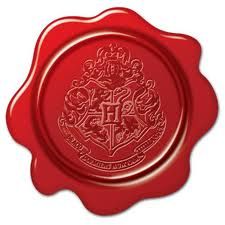 a red wax seal with the crest of hogwart's house on it, in front of a white background