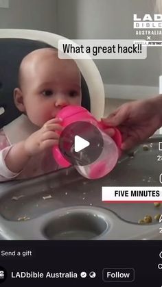 a baby sitting in a high chair eating food from a pink cup with the caption'what a great hack '