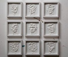 six white square frames with faces drawn on them in different shapes and sizes, each depicting a man's head