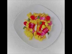 a white plate topped with gummy bears and candy