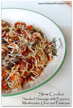 a white plate topped with pasta and meat