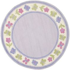 a round rug with flowers and leaves in pastel blue, green, pink and white