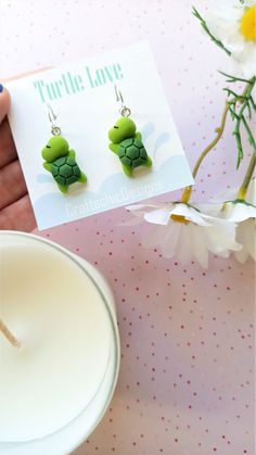 Super cute Turtle earrings, made from resin, in green colors. The closure is leverback, which is very comfortable and easy to wear, just click the back up and you're ready to show them off. The leverback makes sure the earrings will not fall out of your ear and it doesn't require additional pieces to make them secure. Packaging Materials: cardstock backing, holographic ziplock Size: 4 cm (total lenght) 1.5 cm (width) Find Me Here: Facebook: https://www.facebook.com/craftachicdesigns Instagram: h Playful Green Drop Earrings, Playful Green Jewelry With Matching Earrings, Cute Small Handmade Earrings, Green Playful Earrings, Playful Handmade Green Earrings, Handmade Playful Green Earrings, Green Fun Earrings For Gift, Green Fun Earrings For Gifts, Fun Green Earrings For Gifting