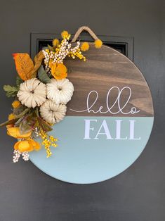 a sign that says hello fall with flowers on it