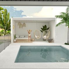 an indoor swimming pool surrounded by palm trees and hanging hammocks in the sun