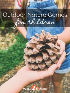 a person holding a pine cone in their hand with the words outdoor nature games for children