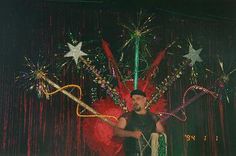 a man standing in front of a stage with fireworks