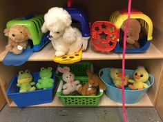 stuffed animals and toys sit on shelves in a playroom