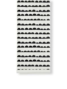 a white wall with black circles on it