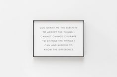 a white wall with a black frame on it that says god grant me the serenity to accept the things i cannot change