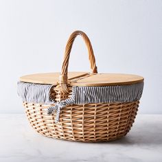 a wicker basket sitting on top of a table