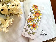 an open notebook with flowers on it