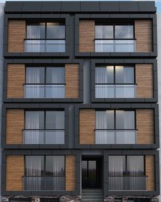 an apartment building with many windows and balconies