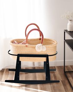 a wicker basket sitting on top of a wooden table