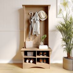 a coat rack with shoes and hats on it next to a potted plant