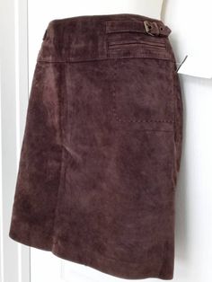 Brand:  Clothes by Revue  Size:   2 Waist:  14 1/2" side to side Hips:   18" side to side Color:   Brown Length:  17" Kick Pleat:     Material:   100%  Leather Lining:   100% Polyester (fully lined)  Made in:  China Condition:  New without tags   Measurements were taken with garment laying flat.   Please check all measurements, as sizes vary from manufacturer to manufacturer, there are no returns excepted.  If you any questions please let me know. Red Leather Pencil Skirt, Red Leather Skirt, Brand Clothes, Lambskin Leather Jacket, Kick Pleat, Leather Pencil Skirt, Lambskin Leather, Brown Suede, Black Suede