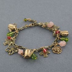 Sadie Green's Garden Charm Bracelet Cheap Vintage Charm Bracelet, Colorful Charm Bracelet, Green Charm Bracelet, Vintage Adjustable Bracelet With Dangling Charms, Vintage Adjustable Bracelets With Dangling Charms, Antique Adjustable Charm Bracelet Gift, Vintage Adjustable Charm Bracelet With Dangling Charms, Vintage Adjustable Charm Bracelet With Lobster Clasp, Charm Bracelet Aesthetic