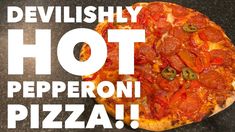 a pizza sitting on top of a table with the words devilish hot pepperoni pizza