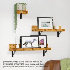 three wooden shelves with pictures on them in the corner and one has a horse photo