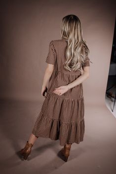 Indulge in the sophistication of the Taryn Gingham Dress on Brown. Made from 100% cotton, this midi dress boasts a modest silhouette and timeless gingham print, making it the perfect fall dress. Elevate your wardrobe with this premium piece that exudes elegance and style. 100 Cotton Model Measurements: Hips 36” Waist 25” Bust: 31”, Height 5’5.5, wearing a size small Bridesmaid Tops, Blessing Dress, Temple Dress, Boho Style Dresses, Fall Dress, Gingham Dress, Gingham Print, Romper Pants, Trending Dresses