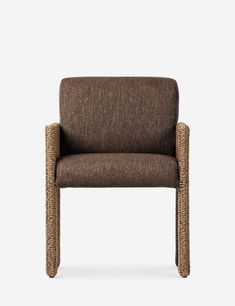 a brown chair with wicker armrests