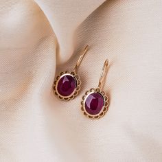 "Oval Cut Ruby Earrings / Engage Wedding Jewelry Earrings / Bridal Jewelry Set / Birthday Gift For Wife / Anniversary Gift Our designs are based on colors of life and each color identifies a motion, a feeling, an emotion and style in each person's life. Ruby, which has been treasured by royal families around the world for centuries, said to be symbol of Love, Power, Loyalty and Wisdom they say.  Go with your heart and find your own meaning in this special design. ╰► Specifications ➤ Made to Order.  ➤ Made in Turkey. ➤ 14K Gold ➤ Custom Gold Color: Rose Gold, Yellow Gold, White Gold ➤ Total CTW: 6.20 Carats ➤ Setting Type: Prong ➤ Ready to Ship in 1 Week ╰► Center Stone Specifications ➤ Gemstone: Glass Filled Ruby ➤ Shape: Oval Cut ➤ Weight: 6.20 Carats (Total for 2 pieces) ➤ Quantity: 2 pi Formal Bridal Gemstone Drop Earrings, Formal Bridal Drop Earrings With Gemstones, Oval Halo Design Bridal Earrings, Oval Halo Design Bridal Earrings For Wedding, Elegant Ruby Earrings With 17 Jewels, Classic Ruby Earrings For Formal Occasions, Evening Ruby Jewelry With Matching Earrings, Oval Bridal Earrings Fine Jewelry Gift, Heirloom Jewelry With Halo Design For Formal Occasions