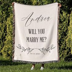 a woman holding up a white blanket with the words advice will you marry me?