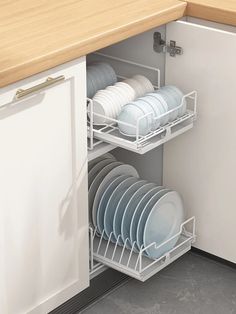 an open dish rack with dishes in it