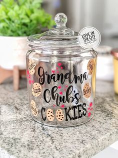 there is a glass jar that has cookies in it