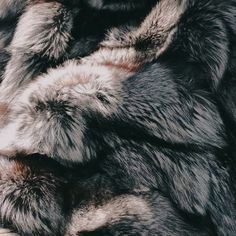 an animal fur texture is shown in black and grey colors, as well as the background