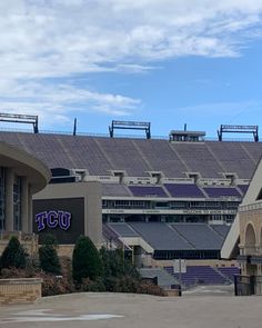 an empty stadium with the words tcu painted on it