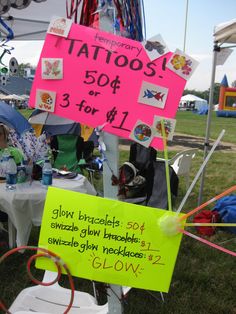 a group of people sitting around a table with signs on it