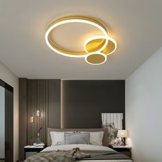 a bed room with a neatly made bed and a round light above the headboard