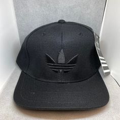 Adidas Black Leaf Adjustable Snapback Hat. Black Casual Snapback Hat For Streetwear, Black Snapback Hat For Streetwear, One Size, Black Baseball Cap With Curved Brim For Streetwear, Trendy Black Snapback Hat With Flat Bill, Black Snapback Hat Casual Style, Casual Black Snapback Hat, Black Hip Hop Fitted Hat For Streetwear, Trendy Black Curved Brim Baseball Cap, Trendy Black Snapback Hat With Curved Brim