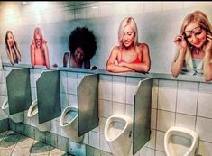 there are many women standing at the urinals