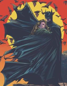 the cover to batman vol 2, featuring two bats and a woman in a cape