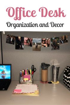 an office desk with pictures hanging on the wall and coffee mugs next to it