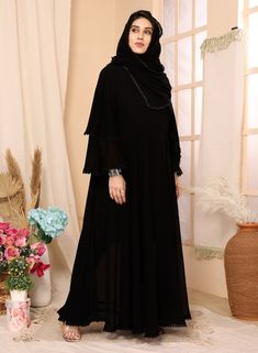 Introducing our elegant black abaya and hijab set, designed for the modern woman seeking modest yet stylish attire. Made from high-quality georgette fabric, this ensemble offers a comfortable and breathable fit. The black color pakistani set exudes sophistication, while the intricate lace work detailing adds a touch of femininity. With full sleeves, this outfit provides modest coverage without compromising on style. Perfect for any occasion, our black abaya and hijab set is a must-have addition to your wardrobe. Long Georgette Abaya For Eid, Georgette Abaya For Eid, Black Maxi Abaya For Eid, Eid Long Georgette Abaya, Black Maxi Length Sets For Eid, Modest Black Dress For Eid, Black Modest Dress For Eid, Black Maxi Length Abaya For Eid, Long Black Abaya For Eid