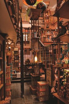 a store filled with lots of wooden shelves and books on top of each shelf in front of a clock