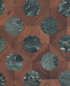 a wooden table topped with lots of green marble